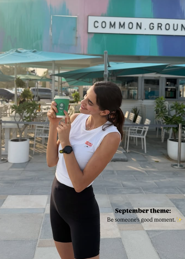 Croissant Run Club member holding a coffee after the morning run